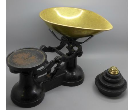 A set of The Viking kitchen scales and a set of cast iron and brass weights 