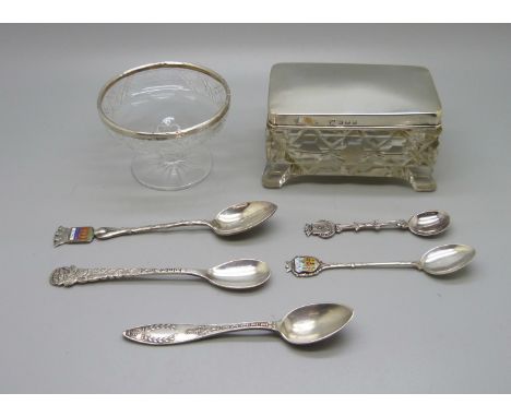 A silver topped glass trinket box, a silver rimmed glass dish and five white metal spoons with continental control marks, (si