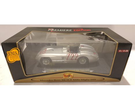 Maisto, a boxed and Signed 1:18 Scale Mercedes Benz 300 SLR Mille Miglia 1955 Signed by Sir Stirling Moss COA Included. Altho