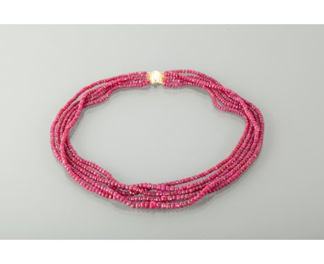 FIVE STRAND RUBY BEAD NECKLACE set with graduated faceted ruby beads, the clasp unmarked, 46cm long