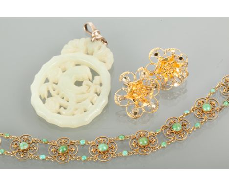 TWENTIETH CENTURY CARVED JADE PENDANT 52mm high; along with a pair of Middle Eastern style stud earrings, unmarked, 3.5g and 