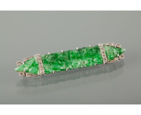 ART DECO JADE AND DIAMOND BROOCH of rectangular form set with a carved section of green jade, the mount set with round diamon