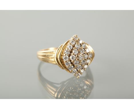 MARQUISE SHAPED DIAMOND CLUSTER RING with a cluster of brilliant cut diamonds, marked 750 for eighteen carat gold, size R