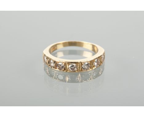 DIAMOND HALF ETERNITY RING set with seven brilliant cut diamonds, marked 18ct for eighteen carat gold, size K-L