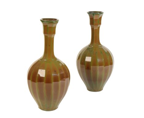 ATTRIBUTED TO THE SAINT LOUIS WORKSHOPS: A LARGE PAIR OF LITHYALIN GLASS VASES,circa 1850, of faceted ovoid form with taperin