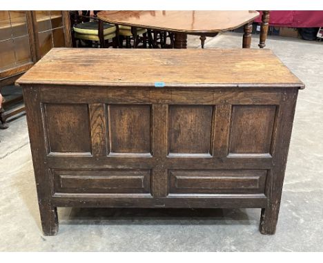 An early 18th century joined oak chest with six panel front raised on stiles. 47'w x 32'h.