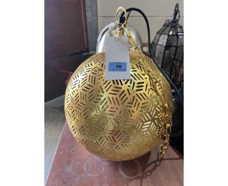 A gilt metal globular hanging lamp. 15' high. Emporio Arts