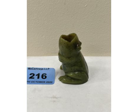 A Chinese carved jade frog with glass eyes. 1¾' high