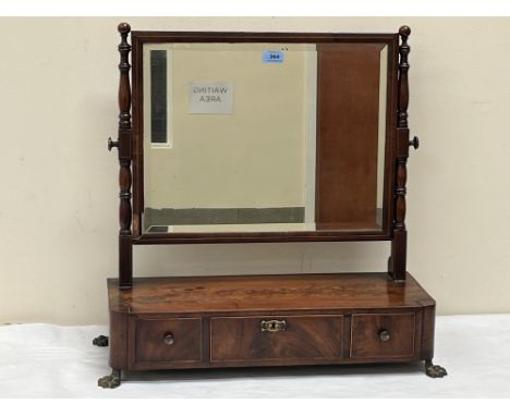 A George IV mahogany and line inlaid dressing table mirror, the bevelled rectilinear plate over base with three drawers raise