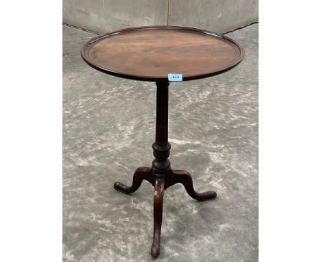 A 19th century mahogany tripod table, the one piece dished top on a fluted column. 20½' diam x 27' high. Old split to top 