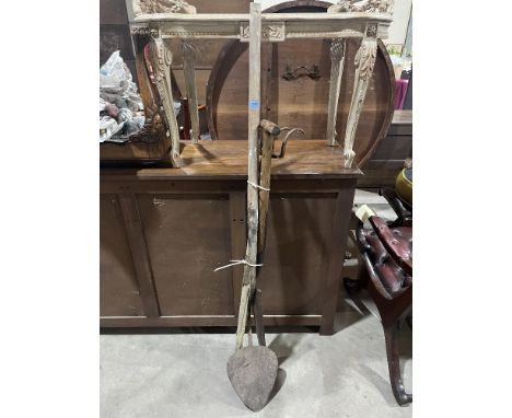 A peat cutter and two other vintage long handled tools