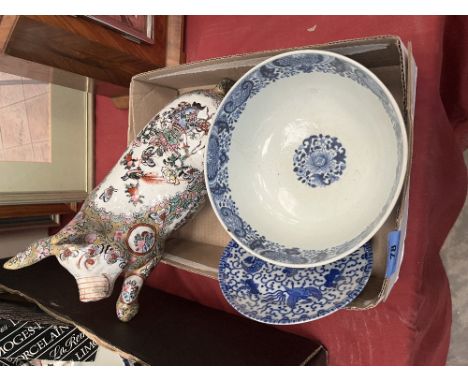 A Chinese famille-rose model of a pig; a Chinese blue and white bowl and a small dish