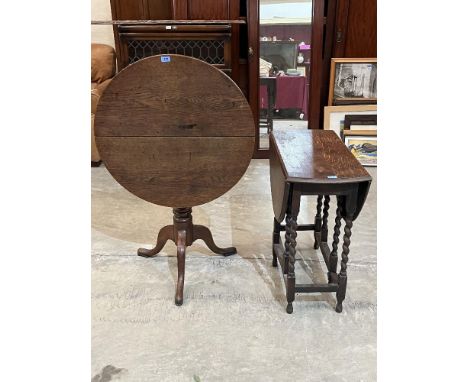 A 19th century oak snap-top tripod table, 29' diam and an oak barleytwist dropleaf table 