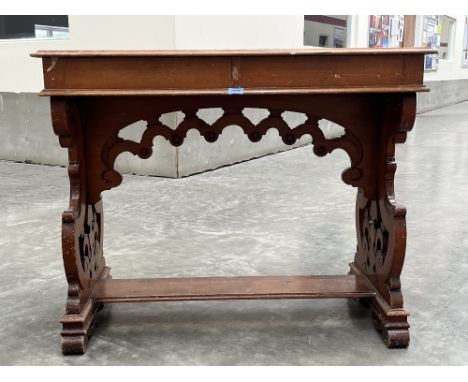 A Victorian decorated pine gothic revival side table, the moulded top over a pair of frieze drawers on pierced fretted scroll