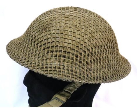 British WWII Brodie helmet with net cover, shell dressing and leather liner, dated 1940. P&amp;P Group 2 (£18+VAT for the fir