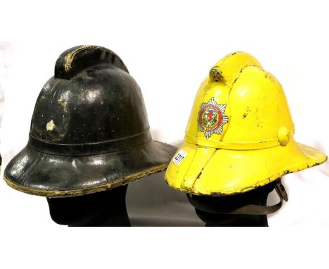 Strathclyde Fire Brigade issued helmet in yellow, with leather liner and stamped 79563, with a further non badged example (2)