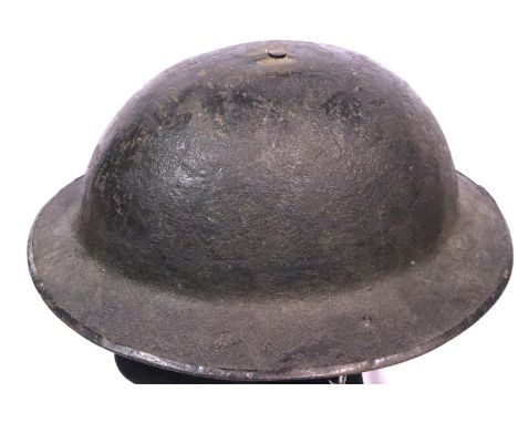 Allied WWI helmet in black, lacking liner. P&amp;P Group 2 (£18+VAT for the first lot and £3+VAT for subsequent lots) 