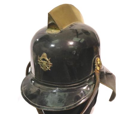 German Fire Brigade leather and brass parade helmet with liner. P&amp;P Group 3 (£25+VAT for the first lot and £5+VAT for sub