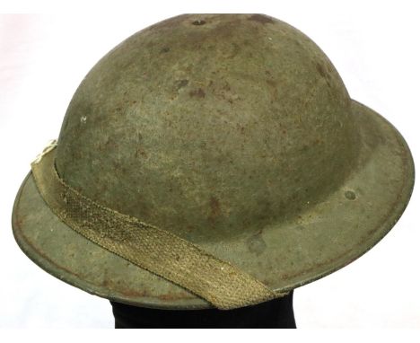 British WWI Brodie helmet with leather liner and canvas chin strap. P&amp;P Group 2 (£18+VAT for the first lot and £3+VAT for