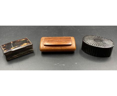 A selection of three snuff boxes, one is a scalloped papier-mache, one in rosewood and the other a horn and tortoiseshell box