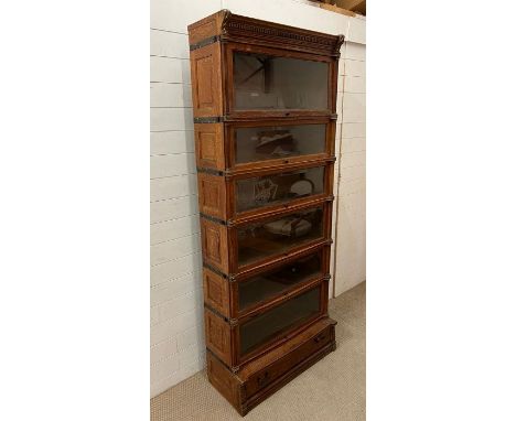 A rare eight section Globe Wernicke bookcase with moulded cornice top, six glazed sections, brass handles 9214 cm High x 89cm