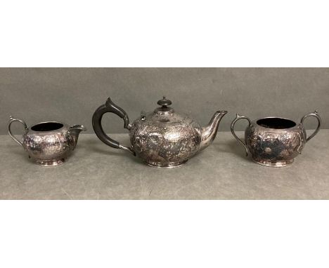 An Arts and Crafts  Tea service comprising teapot, sugar bowl and milk jug