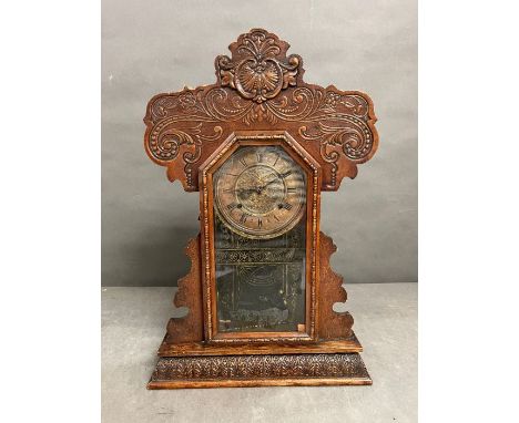 An oak cased gingerbread clock 