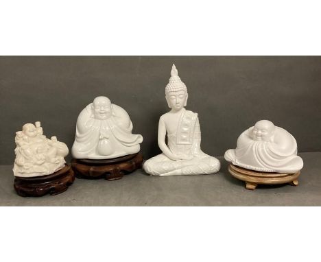 A selection of decorative Buddhas on plinths to include three ceramic and one resin.
