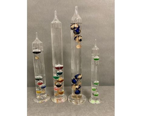 A selection of four glass Galileo thermometer 