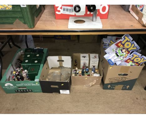 Under table lot comprising of four boxes of Buzz Lightyear figures, Wade figures, Robert Harrop 'Country Companions' Dogs and