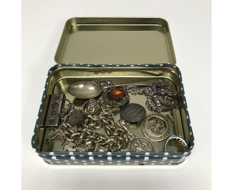 Tin of silver jewellery