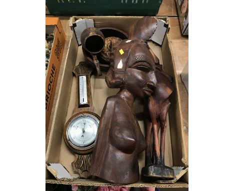 Box containing carved African figures, wooden bowls and a barometer