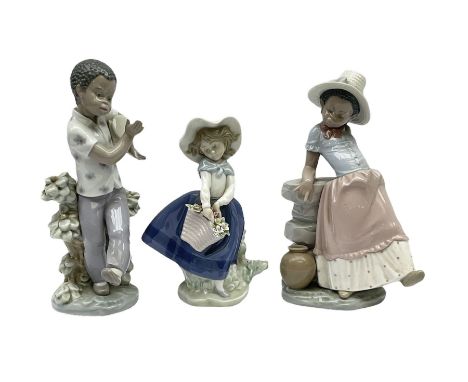 Pair of Lladro figures designed by Jose Roig, Bongo Beat no. 5157 and A Step in Time no. 5158 and a Lladro figure of a girl w
