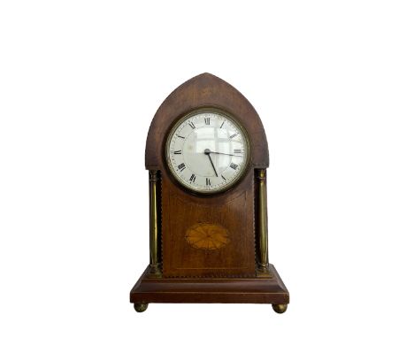 Mahogany “lancet” shaped Edwardian bedside clock c1900 with contrasting stringing and a fan inlay motif, recessed brass balus