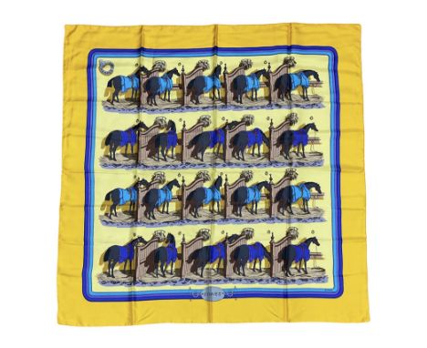 Hermes 'Ecuries' silk scarf, designed by Hugo Grygkar in 1947, printed with twenty horses in their respective stables, on yel