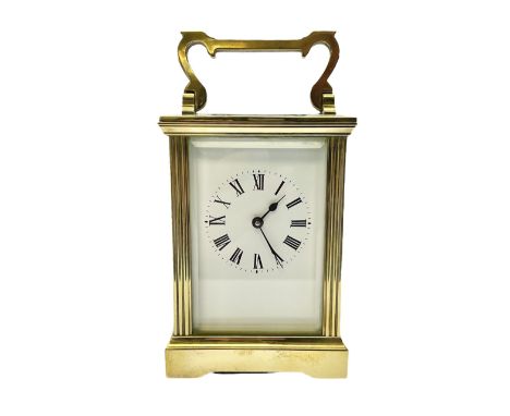 Mid-20th century carriage clock in an anglaise case, white enamel dial with Roman numerals, minute track and steel spade hand