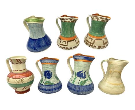 Seven Myott Son &amp; Co hand painted jugs, all with printed mark beneath, H21cm