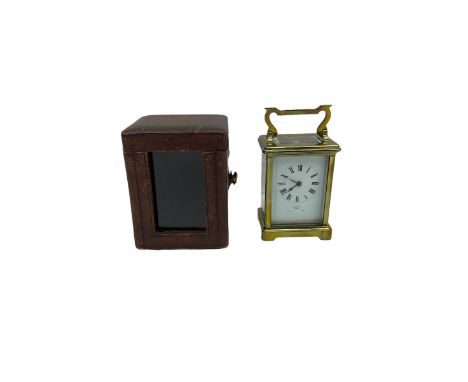 Late 19th century timepiece carriage clock in an anglaise case with the original velvet lined leather traveling case, white e
