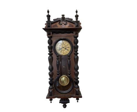 Late 19th cent German wall clock in a mahogany and ebonised case with turned columns and finials, eight-day spring driven mov