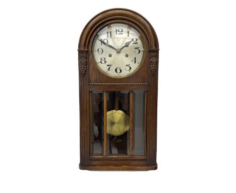 German HAC �ting tang� quarter striking wall clock in a round arched oak case with applied carving and beadwork, glazed door 