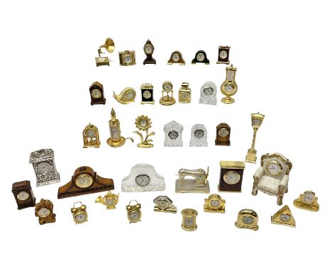 Collection of miniature clocks, predominantly with quartz movements, to include example modelled as an armchair, Edinburgh cr
