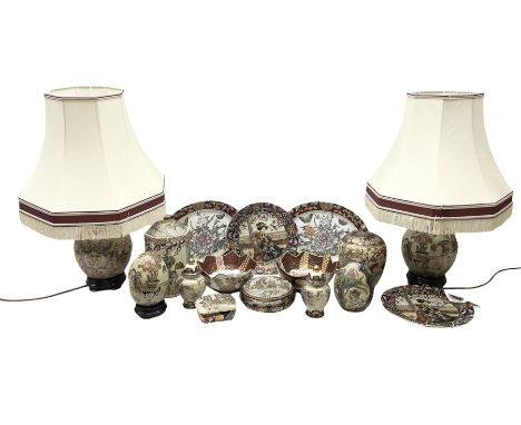 Two 20th century Japanese Satsuma ceramic eggs, decorated with flowers, figures and gilt, together with two Satsuma lamps in 