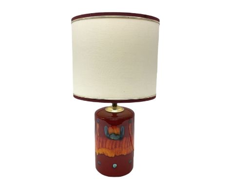 Poole Pottery table lamp in Volcano pattern of cylindrical form, with a cream lampshade, lamp H30cm