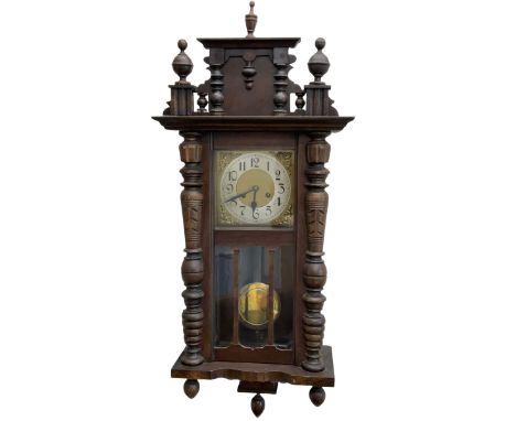 German wall clock in a mahogany vase with turned columns and finials, eight day spring driven movement striking the hours on 