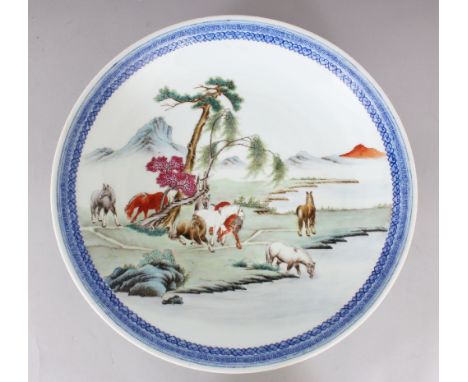 A GOOD QUALITY 20TH CENTURY CHINESE PORCELAIN DISH, painted with a riverside scene of the Eight Horses of Wang Mu, the base w