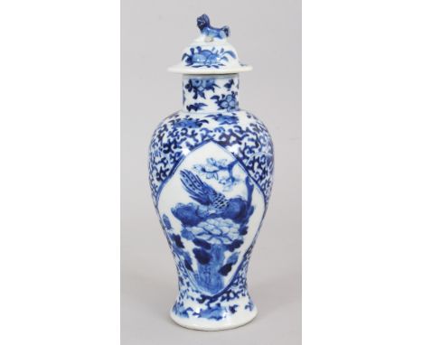 A 19TH CENTURY CHINESE BLUE &amp; WHITE PORCELAIN VASE &amp; COVER, painted with quatrefoil panels of a pheasant, rockwork an