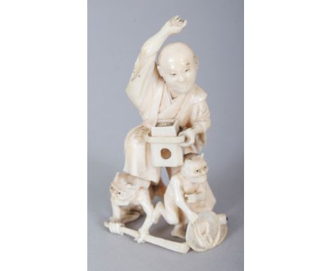 A JAPANESE MEIJI PERIOD IVORY OKIMONO OF AN ANIMATED MAN, quelling two demons, 2.8in high.