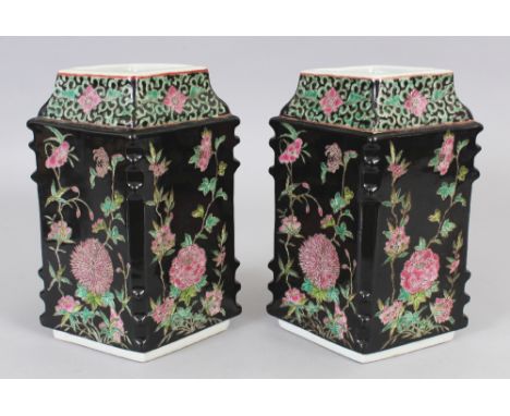 A PAIR OF CHINESE FAMILLE ROSE BLACK GROUND PORCELAIN VASES, of lozenge section, each base with a six-character Kangxi mark, 