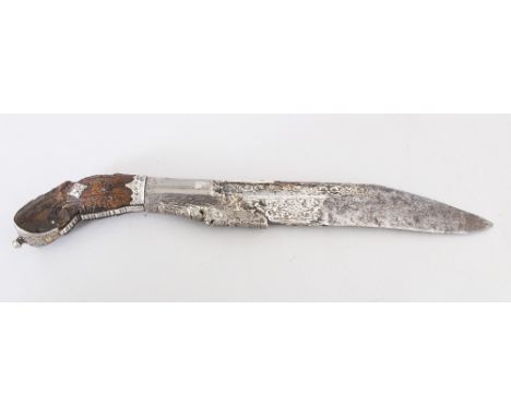 A 19TH CENTURY SRI LANKAN CEYLONESE PIHA KAETTA SILVER-METAL ONLAID STEEL BLADED DAGGER, the wood handle carved with a bird h