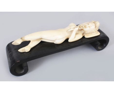 A 19TH/20TH CENTURY CHINESE CARVED IVORY MODEL OF A DOCTOR’S LADY, together with a fitted scroll-footed wood stand, 2.3in hig